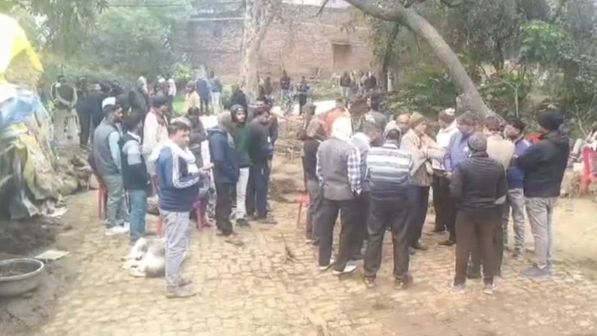 Villagers wait for deceased Army jawan Pawan Yadav's mortal remains in Kanpur