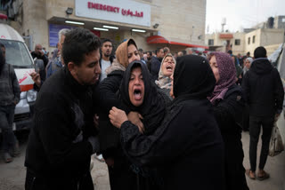 Palestinians mourn their relatives killed in the Israeli bombardment of the Gaza Strip, at Al-Aqsa Martyrs Hospital in Deir al-Balah, Sunday, Jan. 5, 2025.