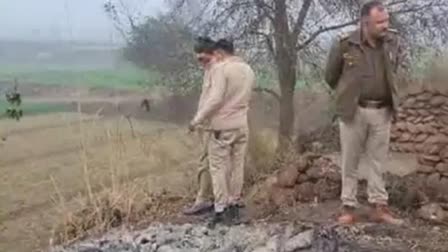 Cops at the spot where a woman was found burnt in honour killing case in Meerut