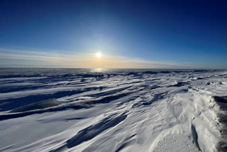 The sun sets outside of the northwest Alaska village of Point Hope on the Chukchi Sea, Feb. 21, 2024. A fatal shooting at a home in a remote Inupiat whaling village on Alaska's northwest coast on Sunday, Feb. 25, 2024, shook the small community in Point Hope. (Ka'ainoa Ravey via AP)