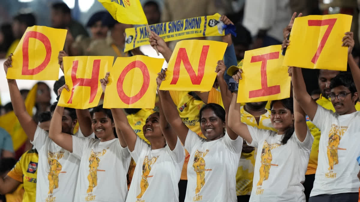 Chennai Super Kings' MS Dhoni's fans hold placards during the Indian Premier League cricket match between Sunrisers Hyderabad and Chennai Super Kings in Hyderabad, India, Friday, April 5, 2024.