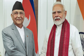Prime Minister Narendra Modi meets Nepal Prime Minister K.P. Sharma Oli, in Bangkok on Friday.
