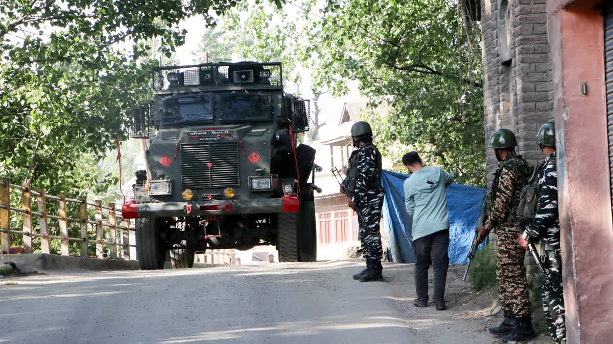 Security personnel patrol after the encounter between security forces and militants, in the Kulgam district of Jammu and Kashmir