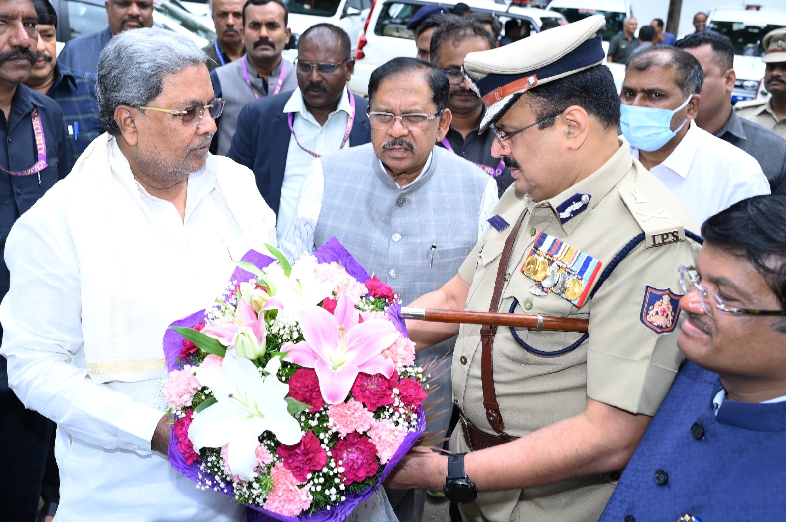 IGP Dr Alok Mohan giving bouquet to CM Siddaramaiah