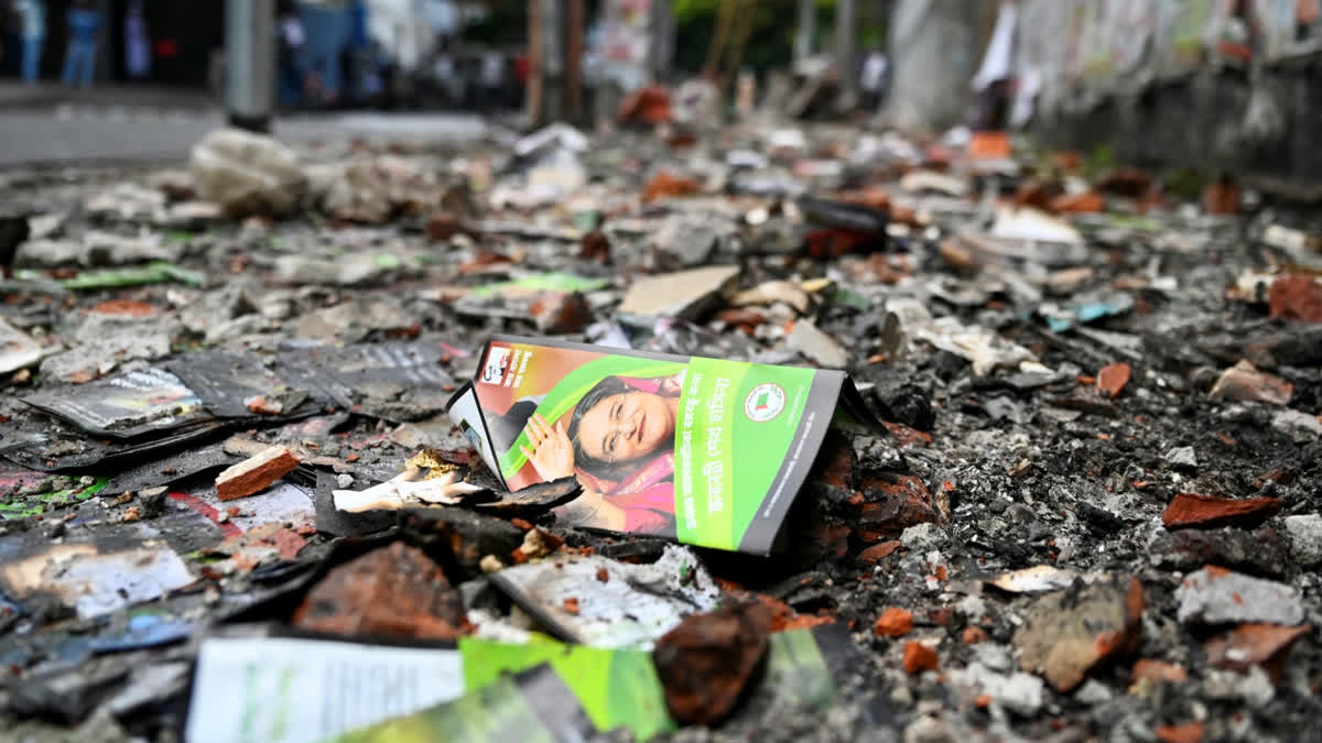 Burnt Awami League party office is pictured as anti-government protestors set fire in Dhaka on August 6, 2024, after former prime minister Sheikh Hasina fled the country.