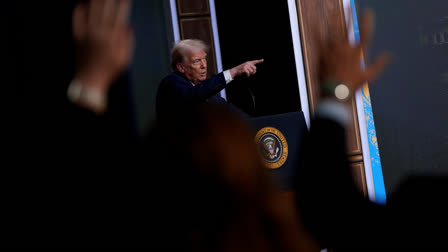 President Donald Trump answers questions from reporters after signing an executive order about the 2028 Los Angeles Olympic Games, in the South Court Auditorium of the Eisenhower Executive Office Building on the White House campus, Tuesday, Aug. 5, 2025, in Washington.