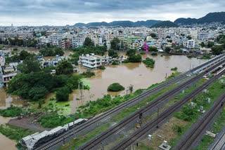 The floods in Vijayawada have caused extensive damage, including destroyed homes and vehicles. Naidu and Chouhan are working to manage the crisis, with Chouhan praising the use of drones for food delivery and promising central government support. Chouhan also noted previous illegal mining may have worsened the situation.