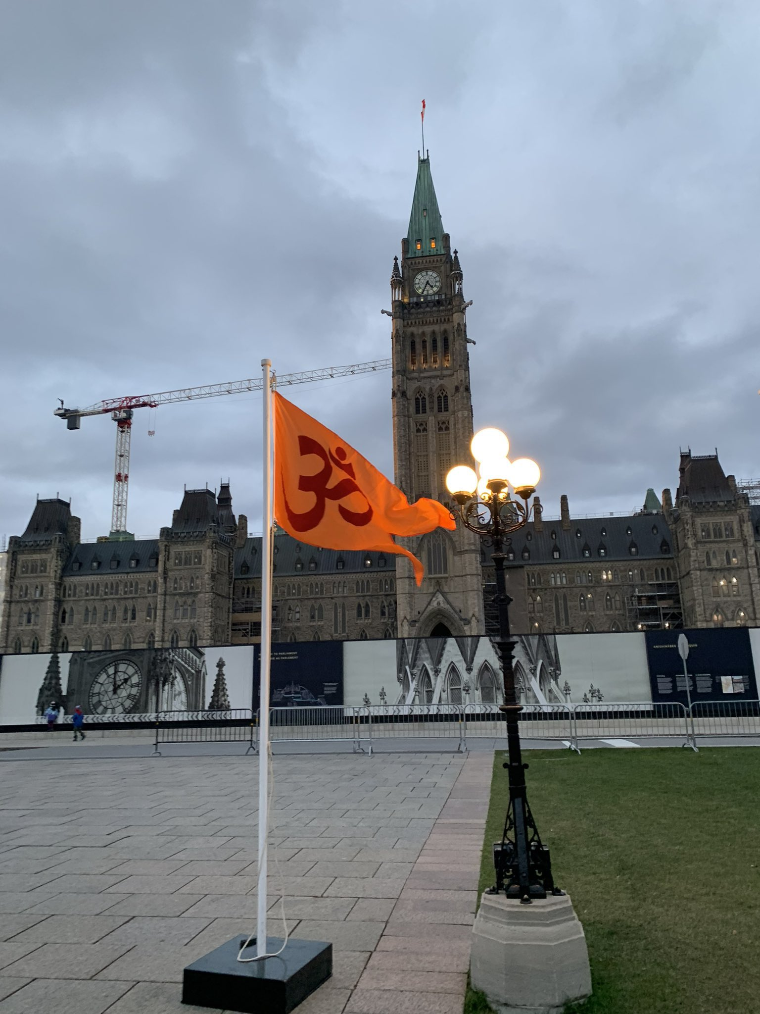 hindu flag with om hoisted at Parliament Hill in canada