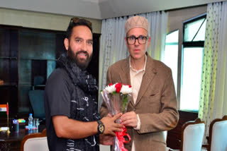 AAP MLA Mehraj Malik, left, with J&K CM Omar Abdullah.