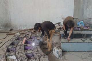 Grab from the Video where the team of artisans can be seen working on constructing the gate from scrap metal sourced from motorcycles and discarded vehicles to create a replica of the Sanchi Stupa gate.