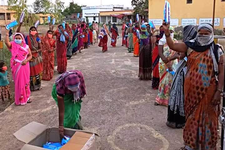 Sanitary napkins being distributed to women laborers