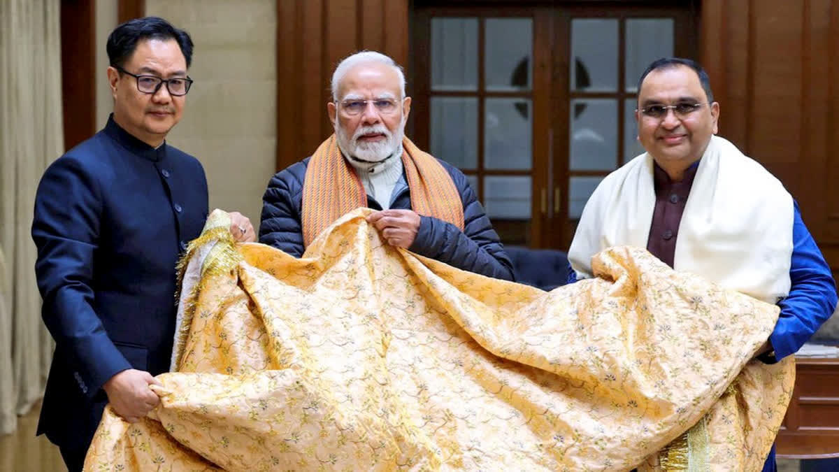 Prime Minister Narendra Modi with Union Minister Kiren Rijiju presents the 'chadar' that would be offered on his behalf at the Ajmer Sharif Dargah on the Urs of Khwaja Moinuddin Chishti.