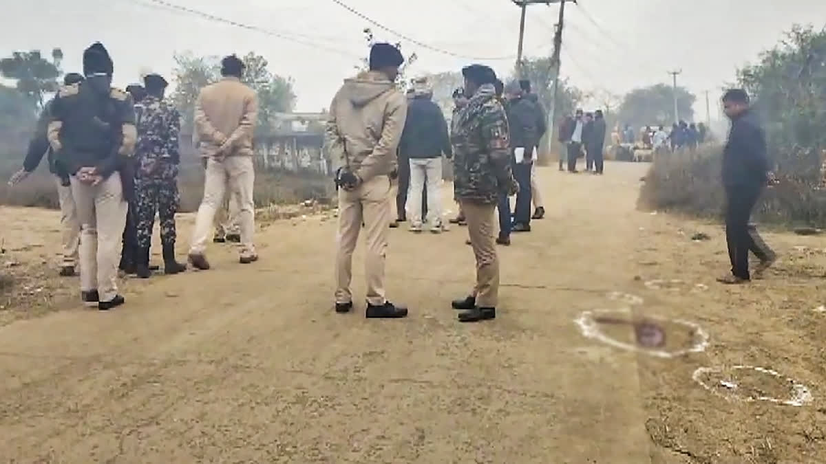 Security personnel at the spot after an encounter with criminals, at Phulwari Sharif, in Patna district, Tuesday, Jan. 7, 2025.