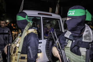 Hamas Terrorist manning the vehicle holding the Israeli hostages
