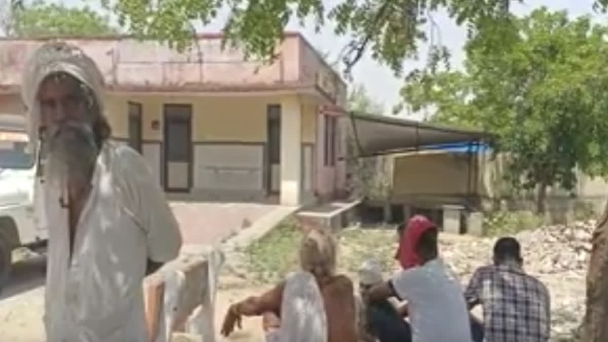 After the suicide of the saint, other sadhus of the ashram are waiting to take the dead body in the mortuary.