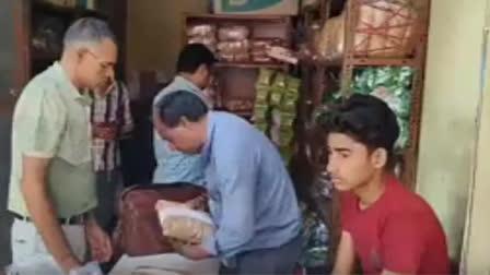 Health department team seizing salty snacks from a warehouse in Alwar