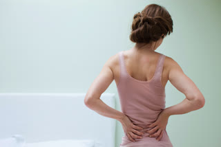 Woman having lower back pain