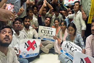 Members of NSUI stage a protest demonstration outside the NTA office calling for a ban on the agency, because of recent exam irregularities, in New Delhi on Thursday.