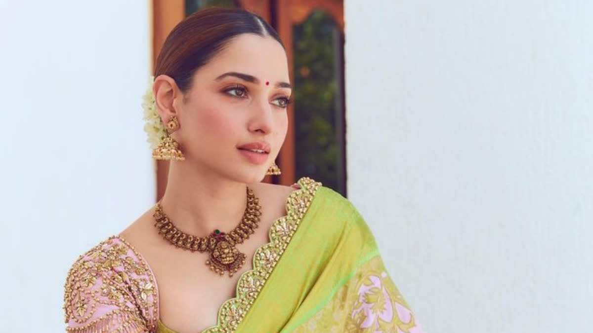 A video of a heartwarming incident involving actor Tamannaah Bhatia has gone viral on social media. The incident occurred during an event in Kerala when an enthusiastic fan attempted to breach security to meet the actor. As the fan jumped over the barricade and approached Tamannaah, the security promptly intervened and pulled him back.