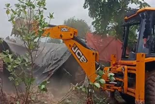 bulldozer ran at house of accused