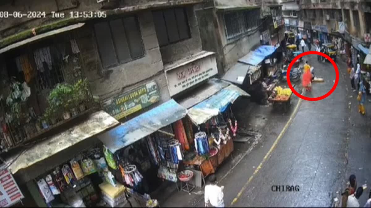 A screengrab of the CCTV footage showing a dog falling on a girl in Maharashtra