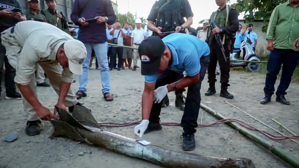 A team of Mobile Forensic Unit, DFS, Manipur collects evidence after what appeared to be a rocket attack, in the Moirang area of Bishnupur on Friday, Sept 6, 2024