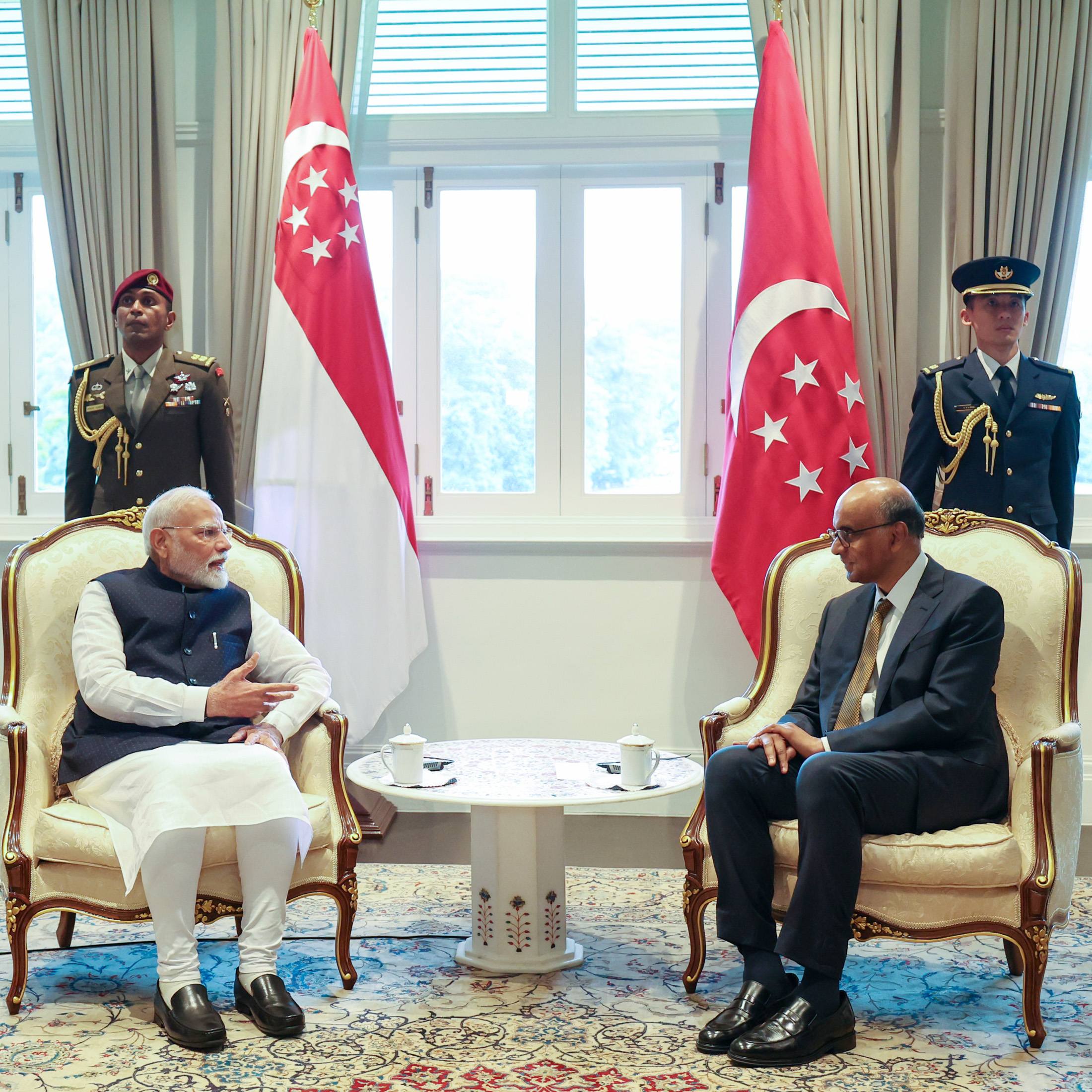 Prime Minister Narendra Modi interacts with Singapore President  Tharman Shanmugaratnam during his visit to