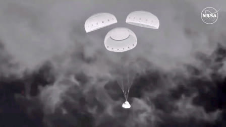 In this image from video provided by NASA, the empty Boeing Starliner capsule floats down towards White Sands Missile Range in New Mexico late Friday, Sept. 6, 2024, after undocking from the International Space Station.