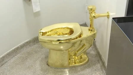 This Sept. 16, 2016 file image made from a video shows the 18-karat toilet, titled “America,” by Maurizio Cattelan in the restroom of the Solomon R. Guggenheim Museum in New York. Four men have been charged over the theft of an 18-carat gold toilet from Blenheim Palace, the sprawling English mansion where British wartime leader Winston Churchill was born. The toilet, valued at 4.8 million pounds, or $5.95 million, was the work of Italian conceptual artist Maurizio Cattelan. (AP Photo)