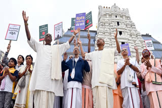 Heads and devotees of ISKCON stage a protest against the against the arrest of ISKCON monk Chinmoy Krishna Das in Bangladesh, in Bengaluru on Sunday.