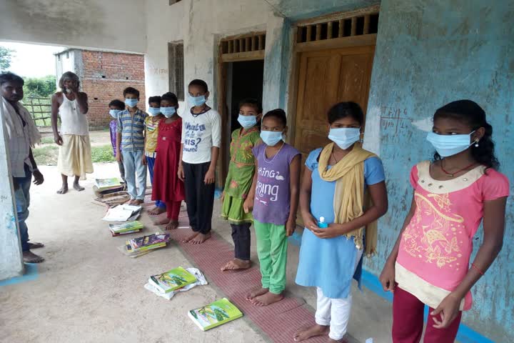 teachers distribute masks and sanitizers