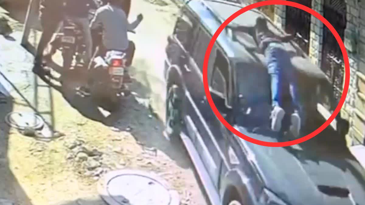 YOUTH CLIMBED ON CAR BONNET