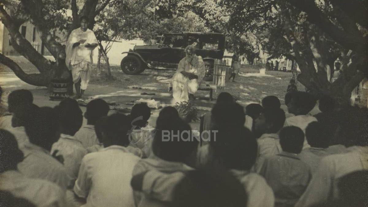 Rabindranatha Tagore with the ashramites in Shantiniketan with the sedan in the backdrop