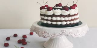 WOMAN CUTS CAKE WITH SWORD