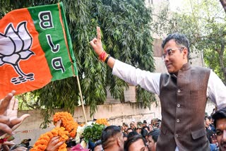 BJP leader Parvesh Verma shows the victory sign after winning his seat in the Delhi assembly elections