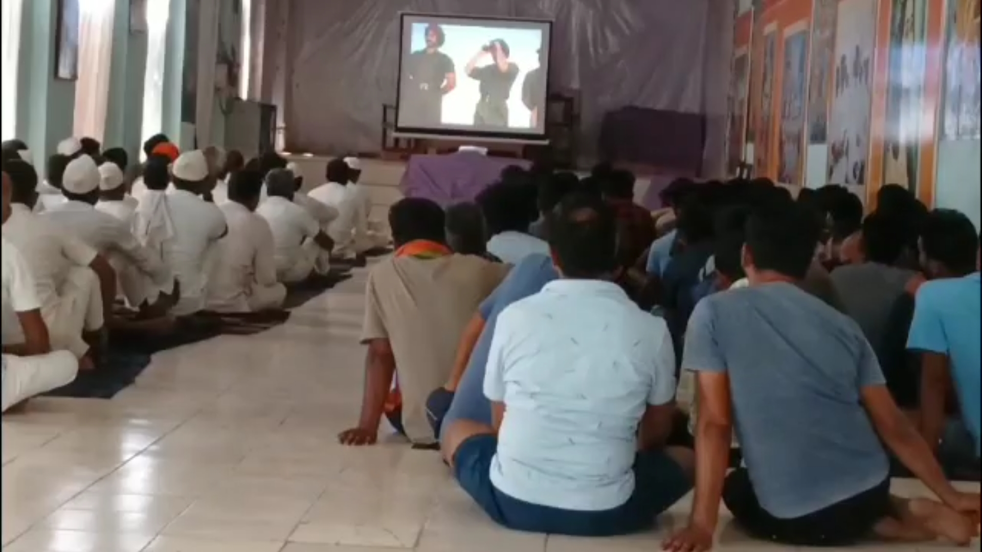 Prisoners watch patriotic cinem