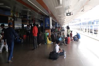 Train passengers wait for their trains amid the farmers protest