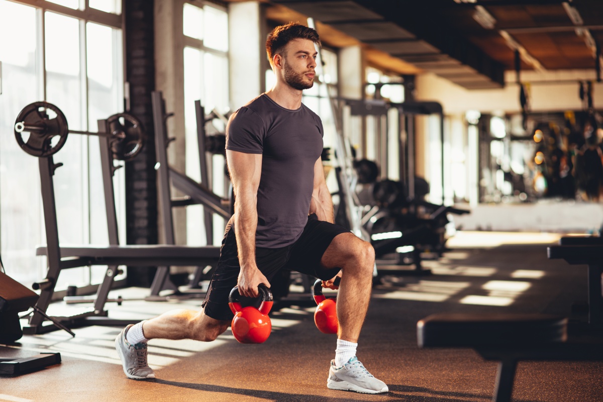 Man who makes Kettlebell squats