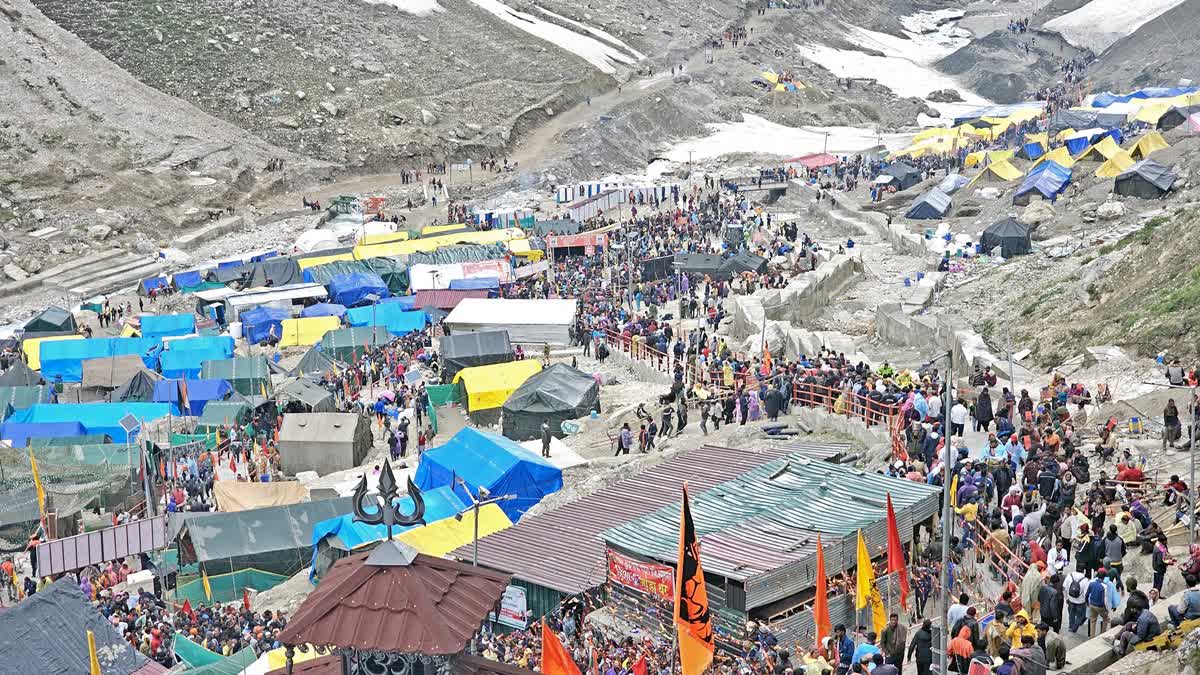 Pilgrims reach a base camp before the Amarnath Yatra, on Sunday July 7, 2024.