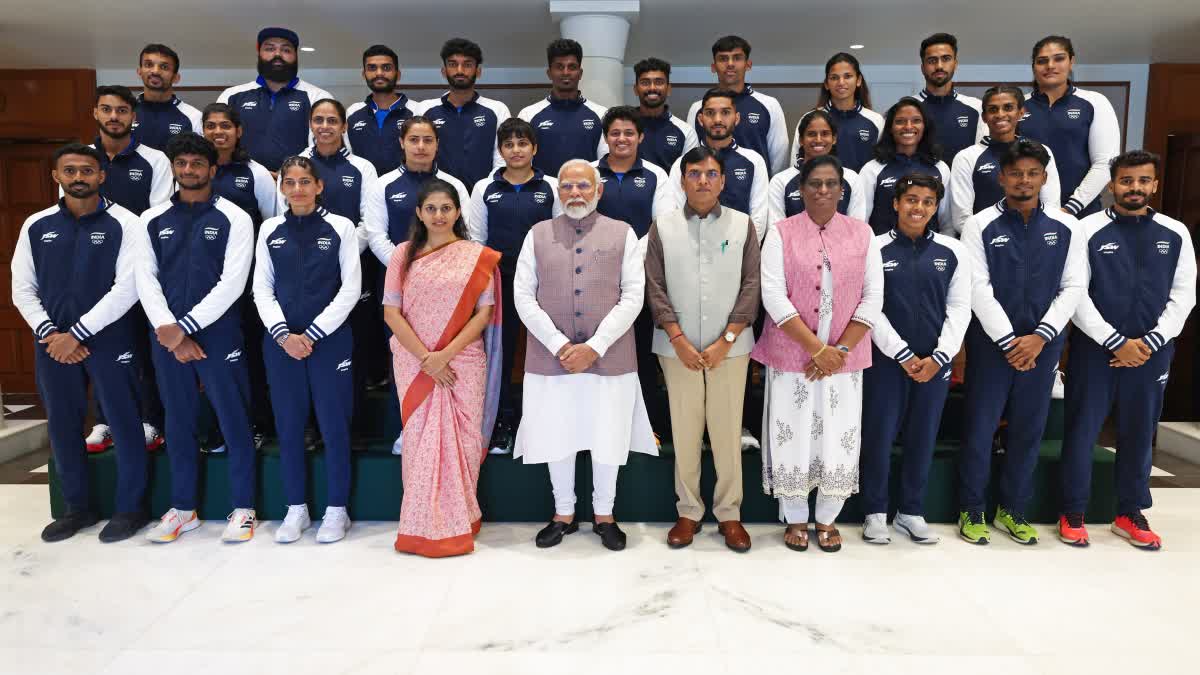 PM Modi poses for a photo with the Indian Contingent heading to the Paris Olympic 2024