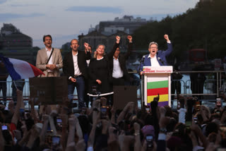 Far-left La France Insoumise - LFI - (France Unbowed) founder Jean-Luc Melenchon, right, clenches his fist with other party members after the second round of the legislative elections on Sunday, July 7, 2024, in Paris.