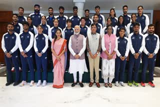 PM Modi poses for a photo with the Indian Contingent heading to the Paris Olympic 2024