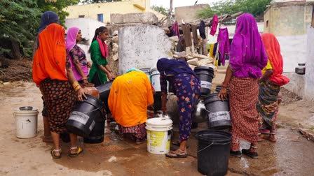 Villagers collect drinking water from a roadside tap on a hot summer day, in Ajmer, Rajasthan..