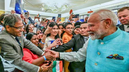 PM Narendra Modi interacts with members of Indian diaspora gathered at The Carlton Hotel in Moscow on Monday.