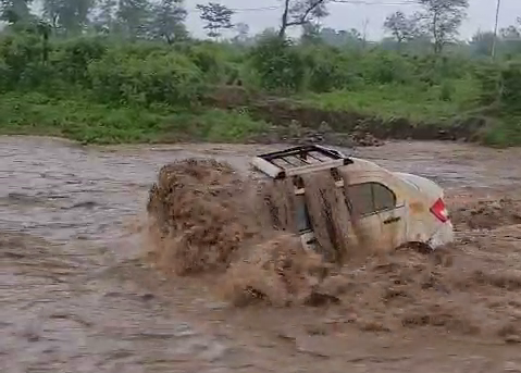 Two Car Washed Away in Drain