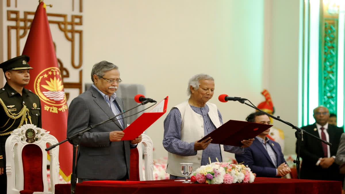 Bangladesh's figurehead, President Mohammed Shahabuddin, administers the oath of office to Nobel laureate Muhammad Yunus as the head of Bangladesh's interim government in Dhaka on August 8.