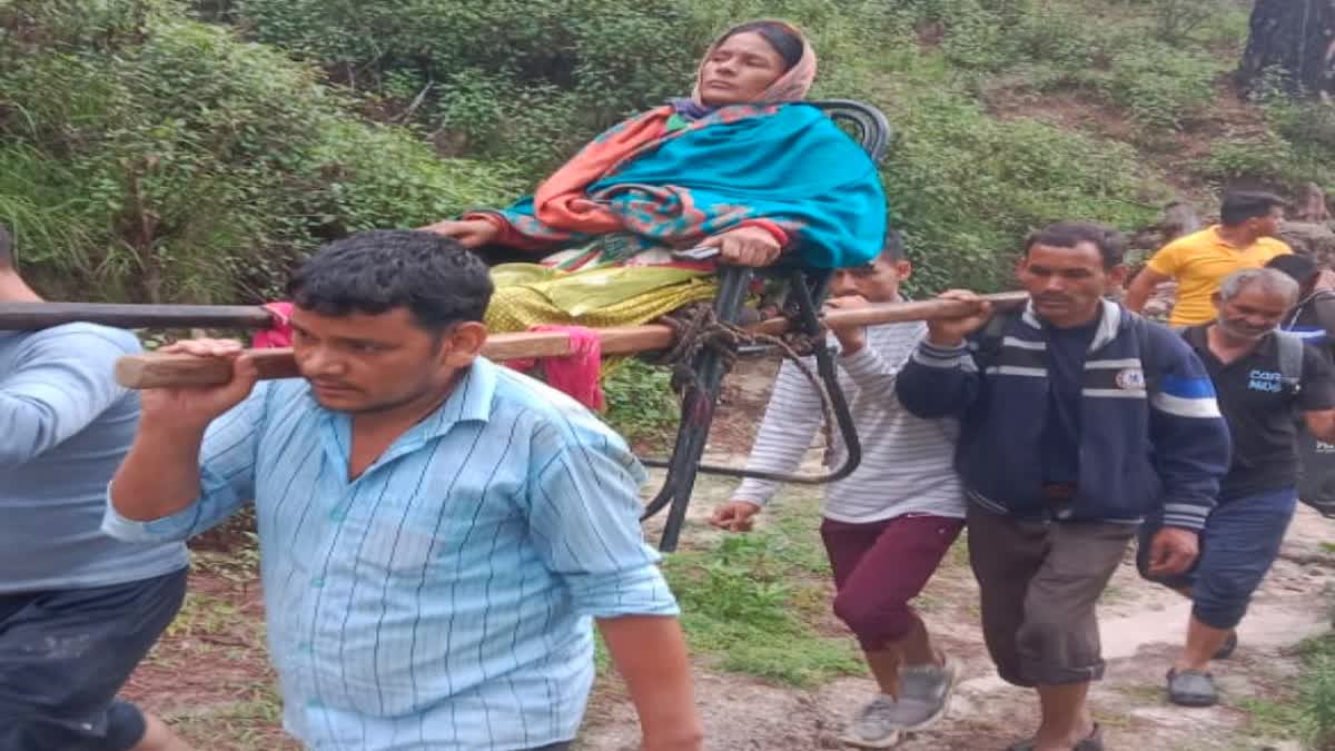 Woman Carried on Dandi Kandi in Pauri