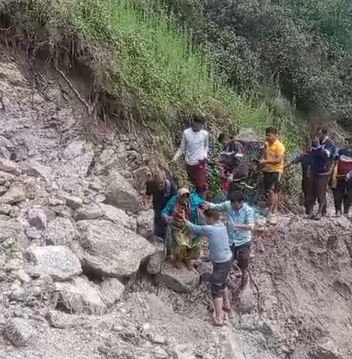 Woman Carried on Dandi Kandi in Pauri