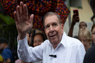 Venezuelan opposition presidential candidate Edmundo Gonzalez waves to supporters during a political event at a square in the Hatillo municipality of Caracas, Venezuela, June 19, 2024.