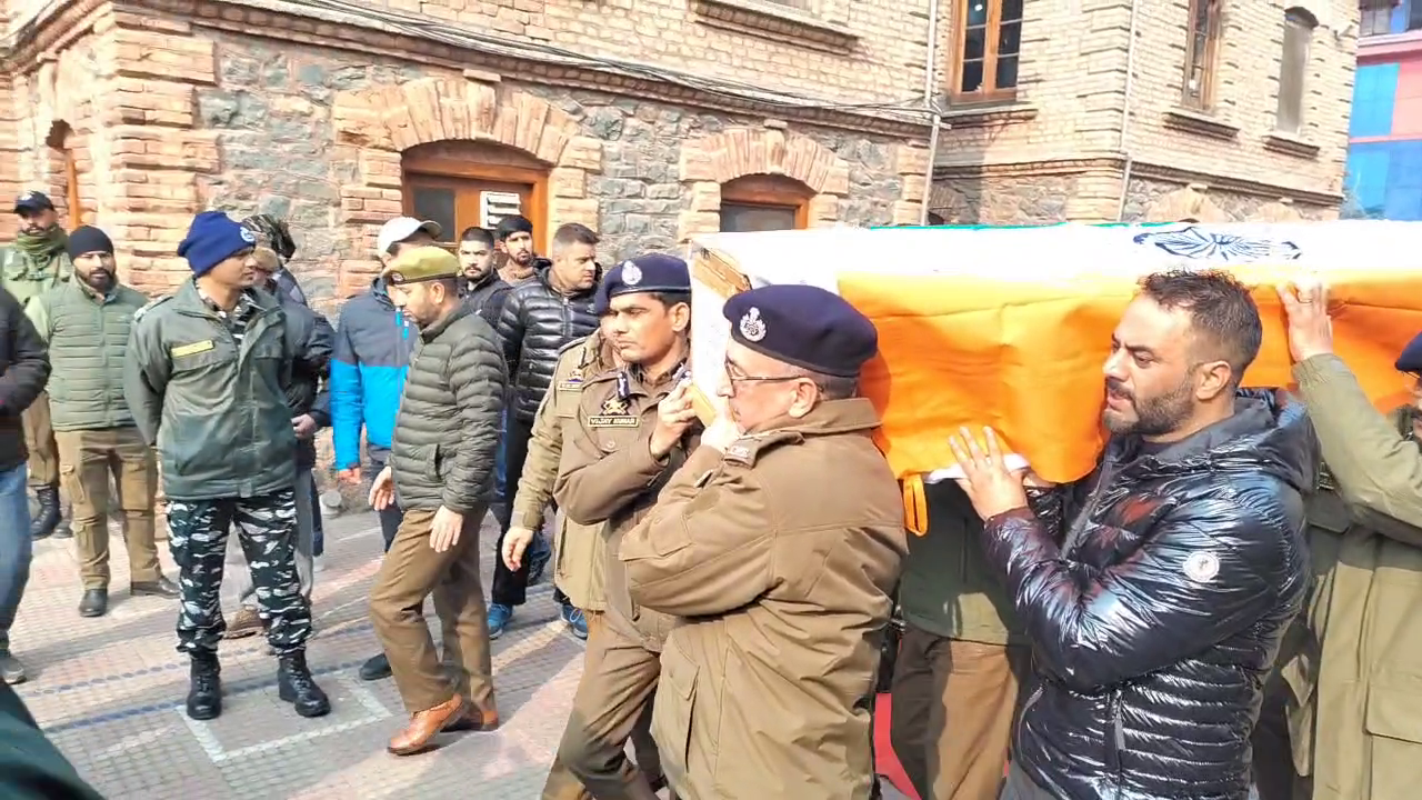 Officers carrying dead body of police inspector